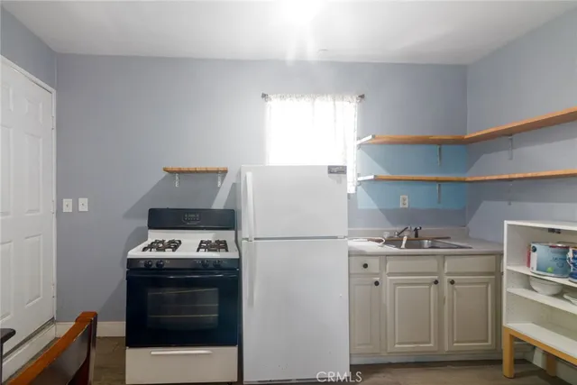 a kitchen with cabinets and appliances