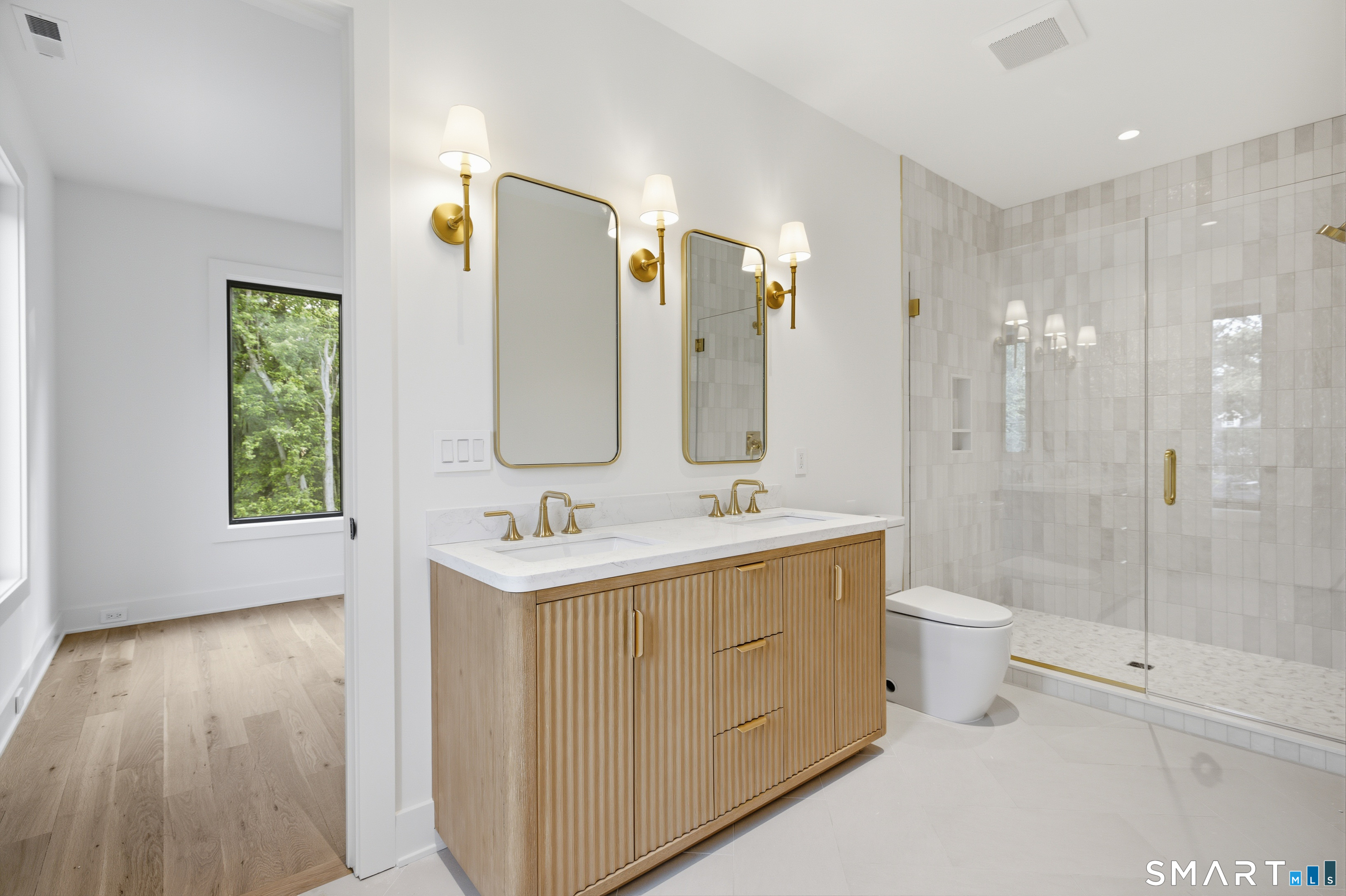 2 Windy Hill Road Westport, CT 06880 - Photo 30 of 40 a bathroom with a double vanity sink toilet and shower