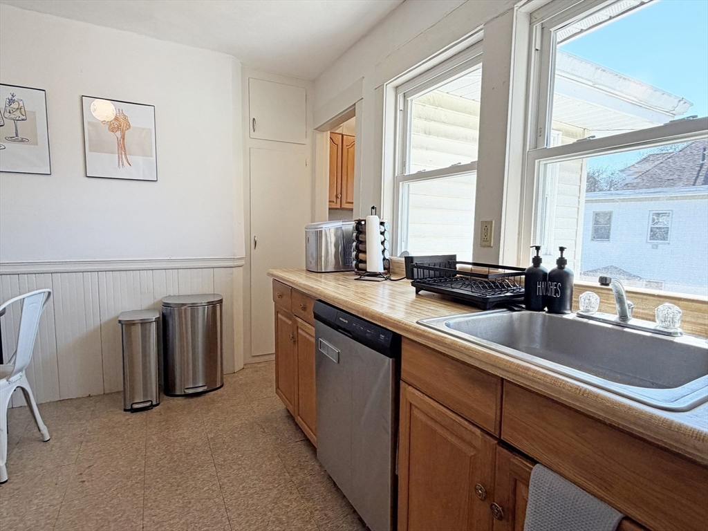 12-14 Nottingham Street Newton, MA 02459 - Photo 11 of 29 a kitchen with a sink and large window