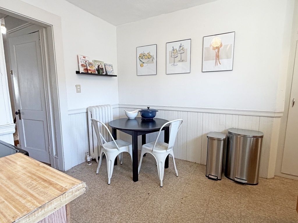 12-14 Nottingham Street Newton, MA 02459 - Photo 12 of 29 a dining room with furniture and a window