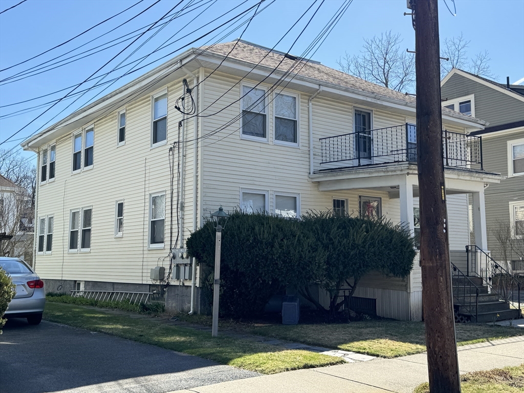 12-14 Nottingham Street Newton, MA 02459 - Photo 2 of 29 a front view of a house with garden