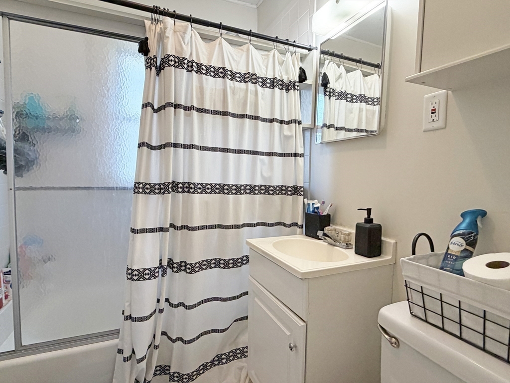 12-14 Nottingham Street Newton, MA 02459 - Photo 22 of 29 a view of storage and utility room with washer and dryer