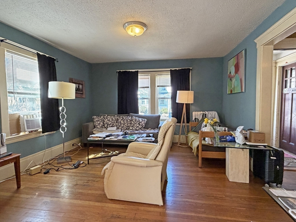 12-14 Nottingham Street Newton, MA 02459 - Photo 23 of 29 a living room with furniture and a wooden floor