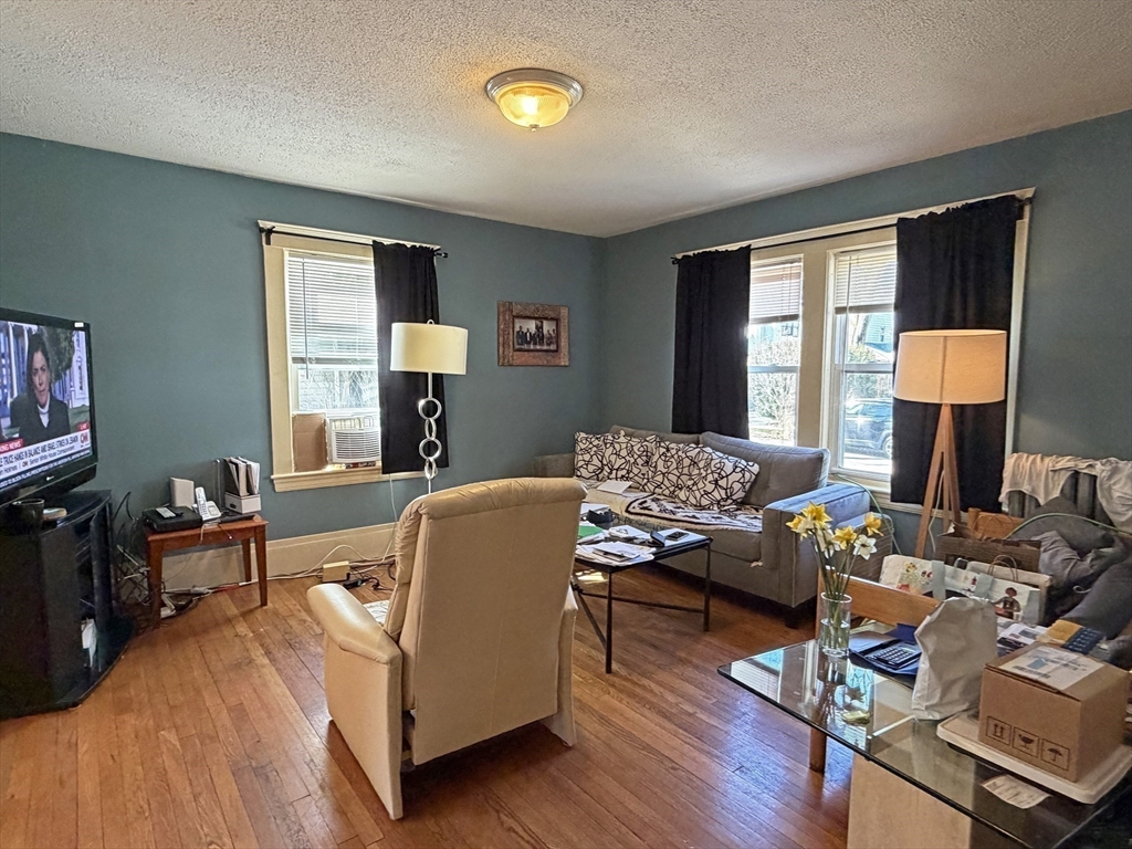 12-14 Nottingham Street Newton, MA 02459 - Photo 24 of 29 a living room with furniture and a lamp