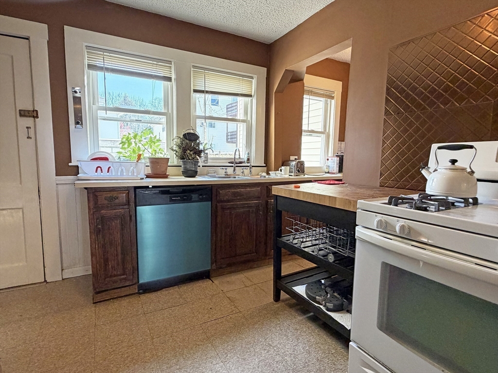 12-14 Nottingham Street Newton, MA 02459 - Photo 26 of 29 a kitchen with a sink and cabinets