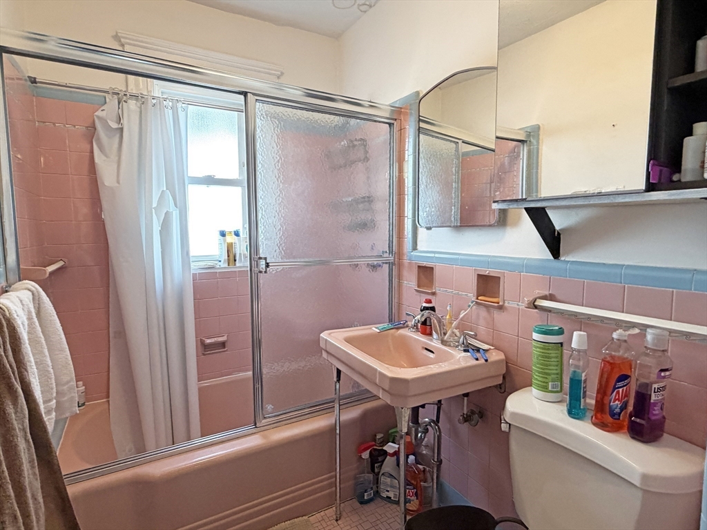 12-14 Nottingham Street Newton, MA 02459 - Photo 27 of 29 a bathroom with a sink a toilet and shower