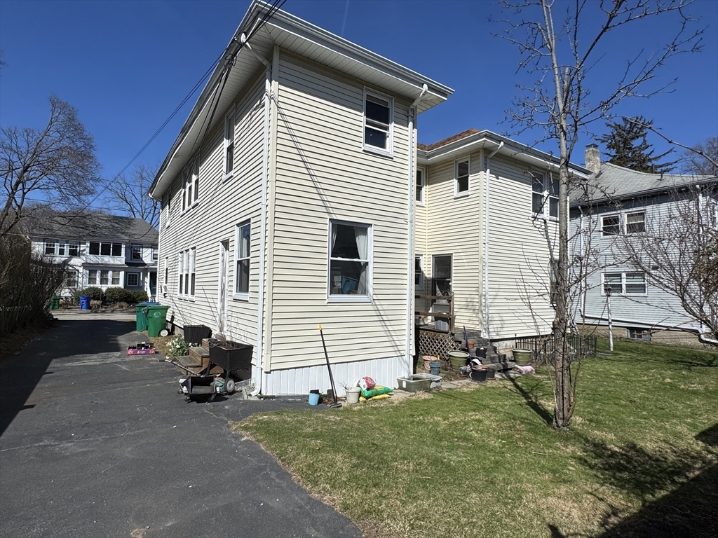 12-14 Nottingham Street Newton, MA 02459 - Photo 29 of 29 a view of a house with a yard