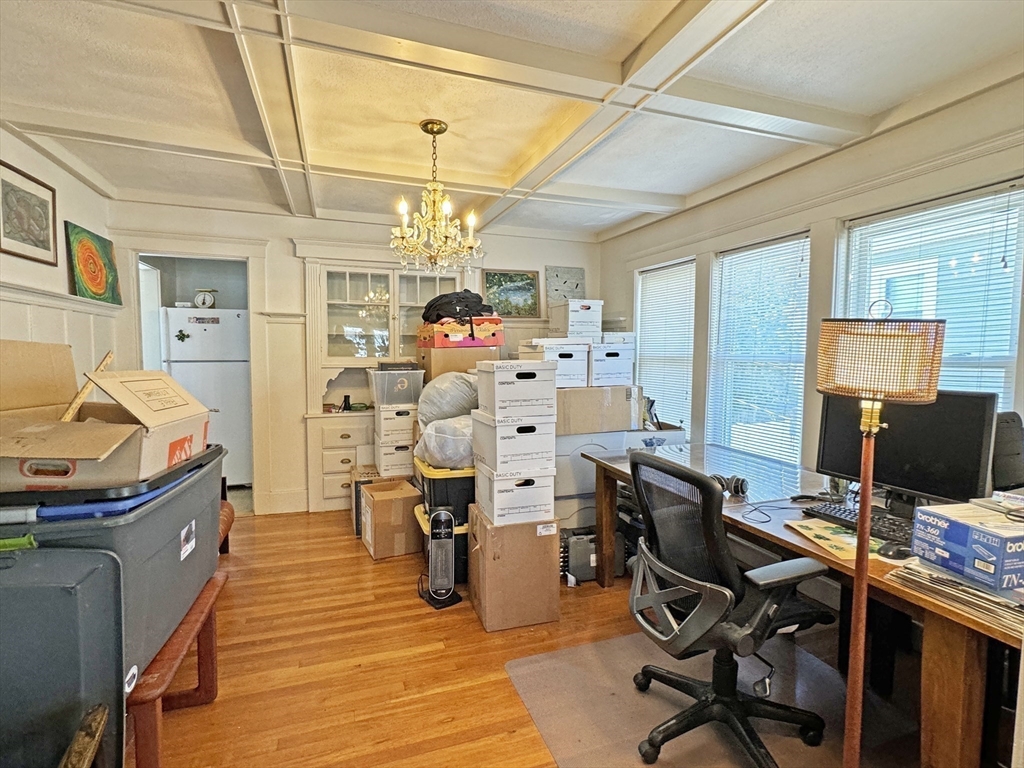 12-14 Nottingham Street Newton, MA 02459 - Photo 7 of 29 a view of a workspace with furniture and a window