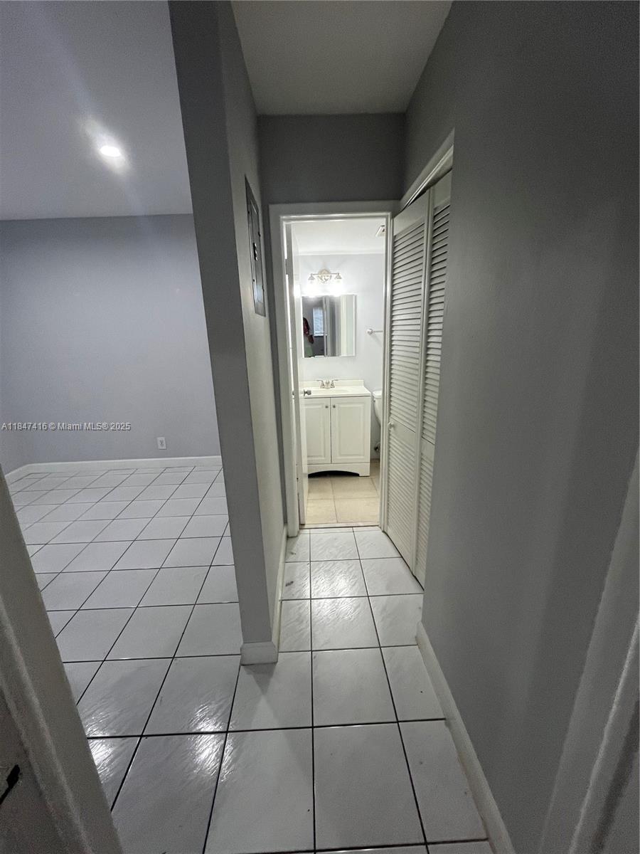 8404 West Sample Road, Unit 131 Coral Springs, FL 33065 - Photo 18 of 36 a view of a hallway