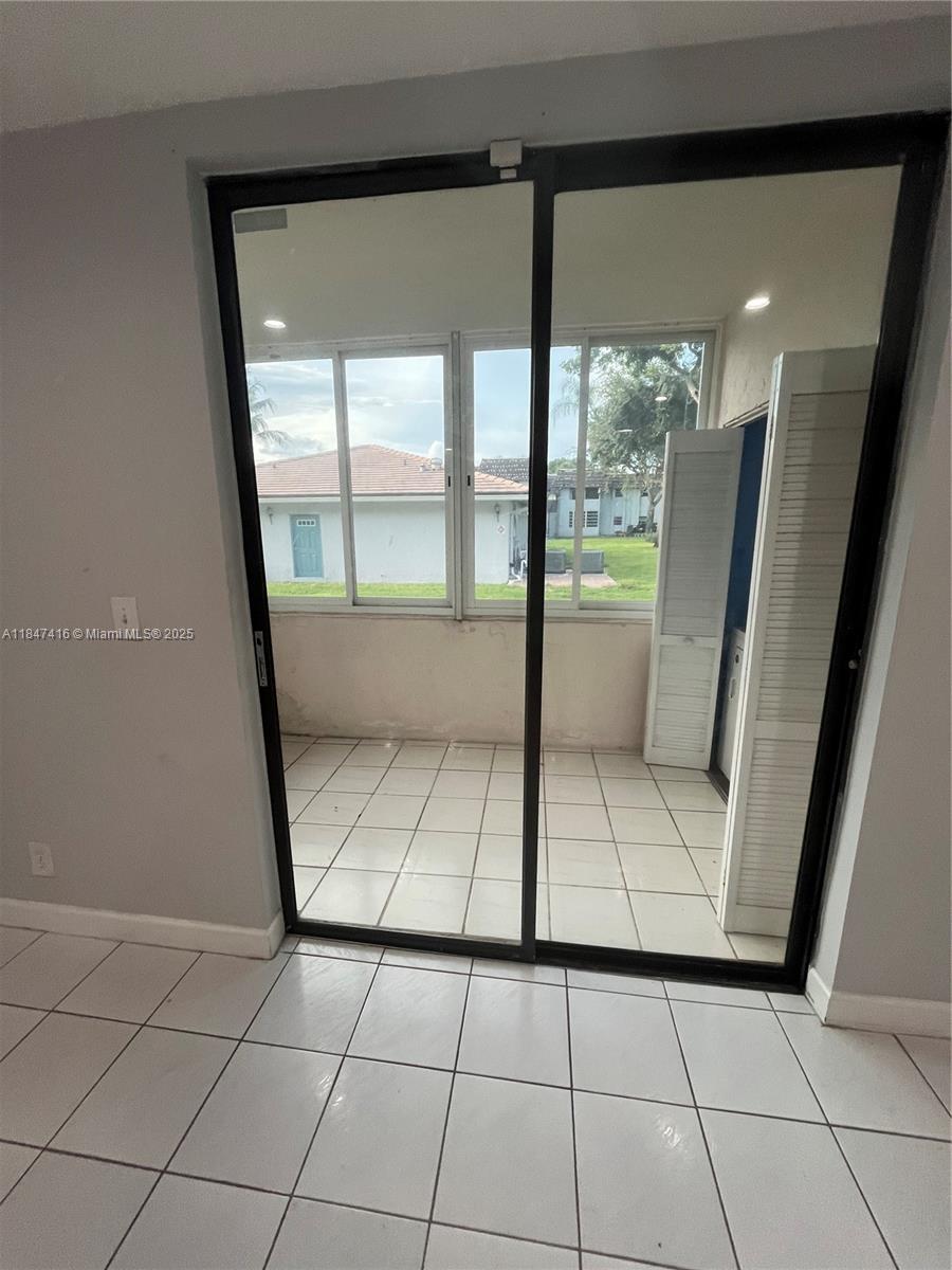 8404 West Sample Road, Unit 131 Coral Springs, FL 33065 - Photo 31 of 36 a view of an empty room and window