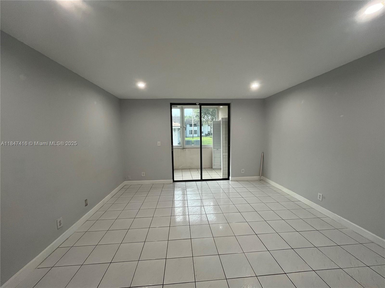 8404 West Sample Road, Unit 131 Coral Springs, FL 33065 - Photo 34 of 36 a view of an empty room and window