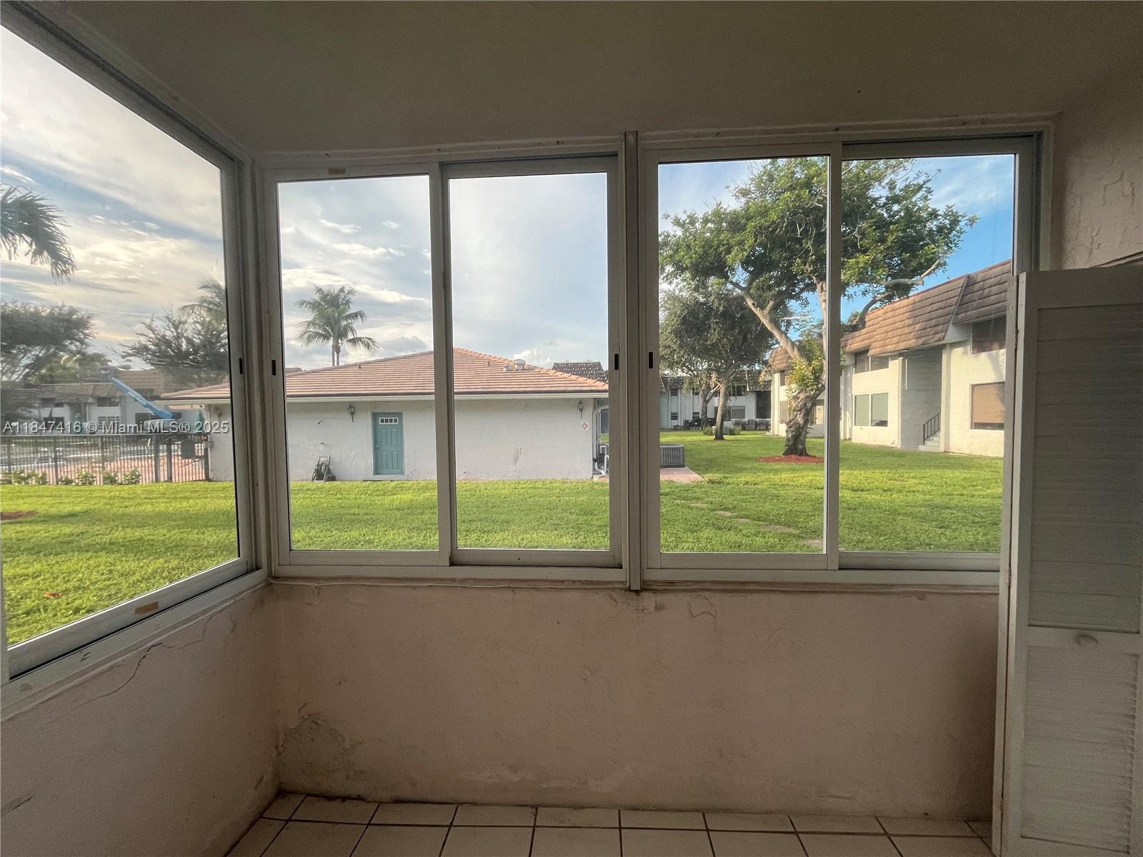 8404 West Sample Road, Unit 131 Coral Springs, FL 33065 - Photo 35 of 36 a view of balcony with an outdoor space