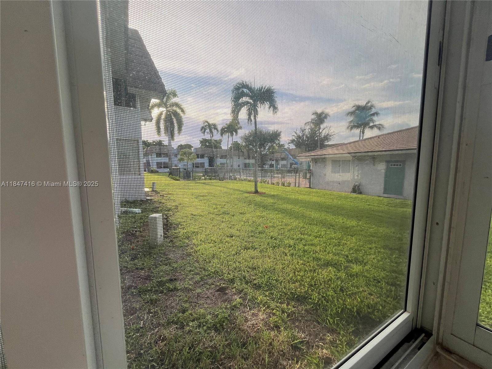 8404 West Sample Road, Unit 131 Coral Springs, FL 33065 - Photo 36 of 36 a view of a lake from a window