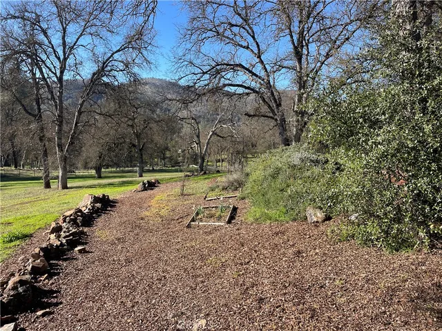 a kitchen with a table chairs sink and cabinets
