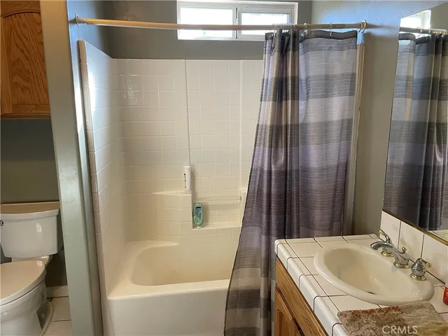 a bathroom with a toilet and a sink