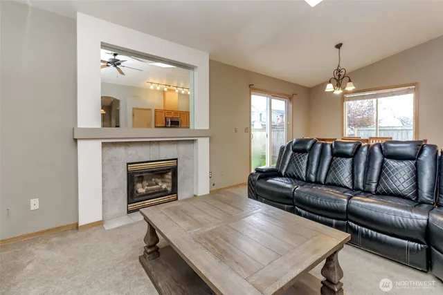 a living room with a couch and a fireplace