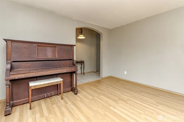 a view of room with wooden floor