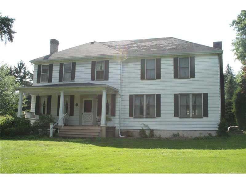 Exterior Front. Front of the home, big front porch, flat front yard.