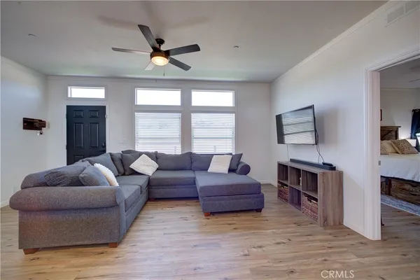 a living room with furniture and a large window