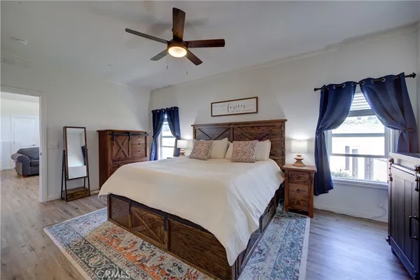 a bedroom with a bed and a chandelier