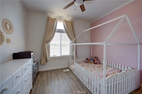 a bedroom with furniture and a window