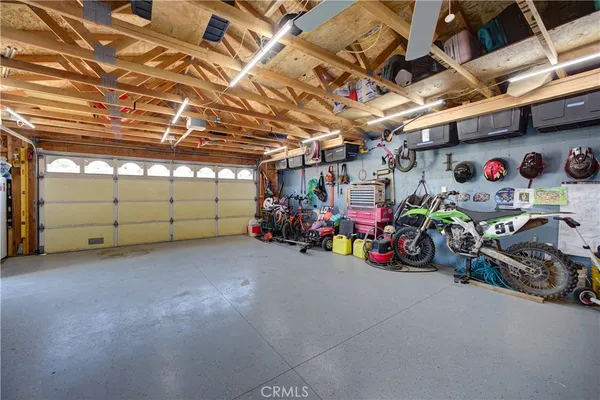 a view of a garage with a lot of stuff