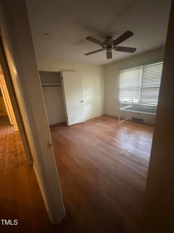 a view of an empty room and a window