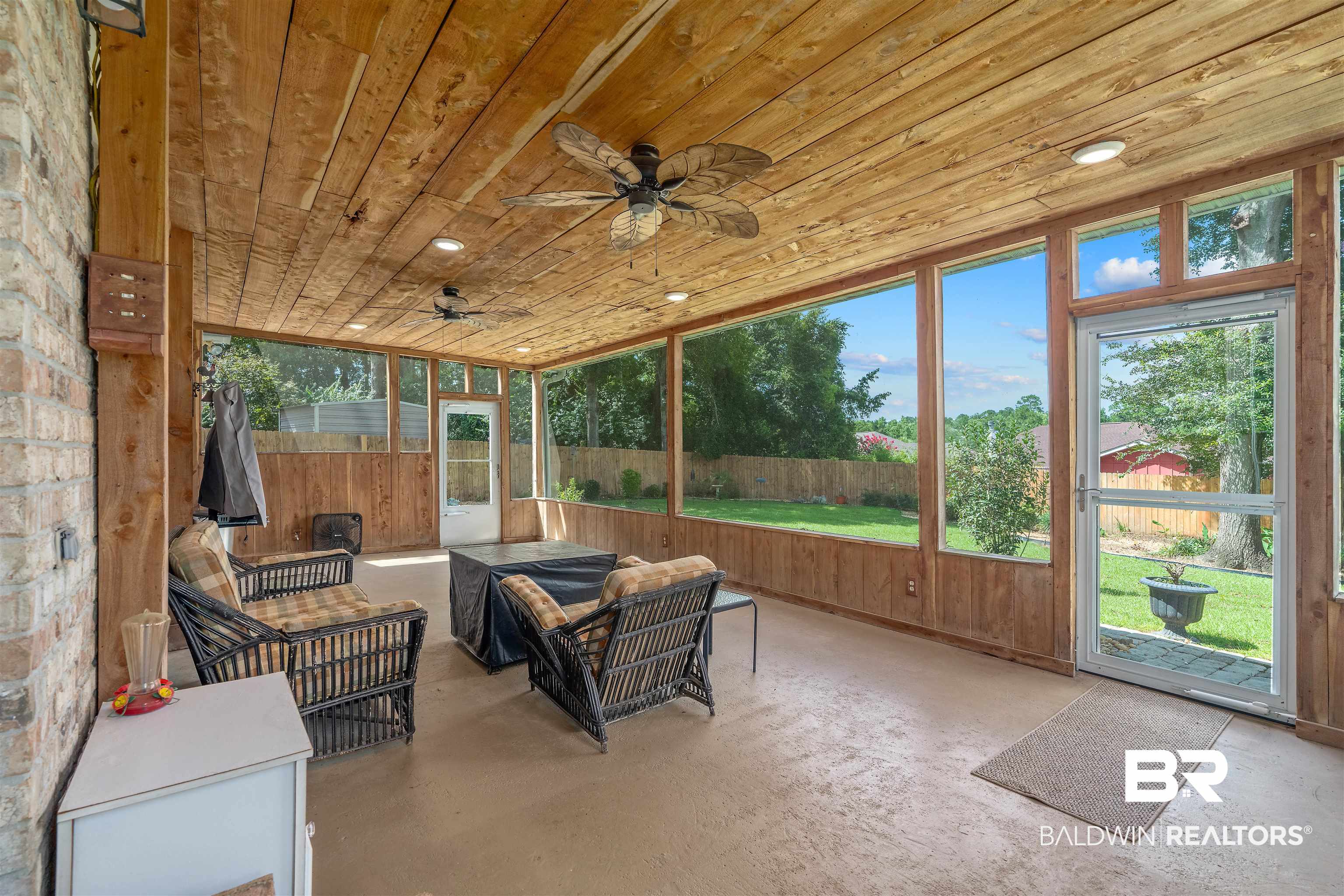 11097 Pontchartrain Loop Daphne, AL 36526 - Photo 9 of 28 Sunroom / solarium featuring a ceiling fan and outdoor lounge area