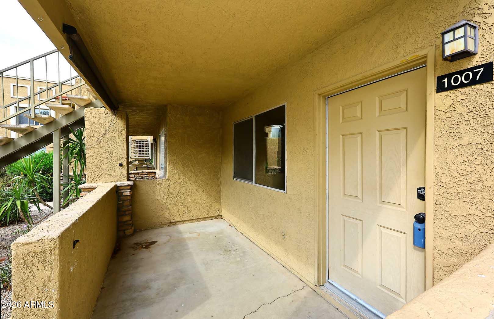 303 North Miller Road, Unit 1007 Scottsdale, AZ 85257 - Photo 5 of 45 a view of entryway and hall with wooden floor