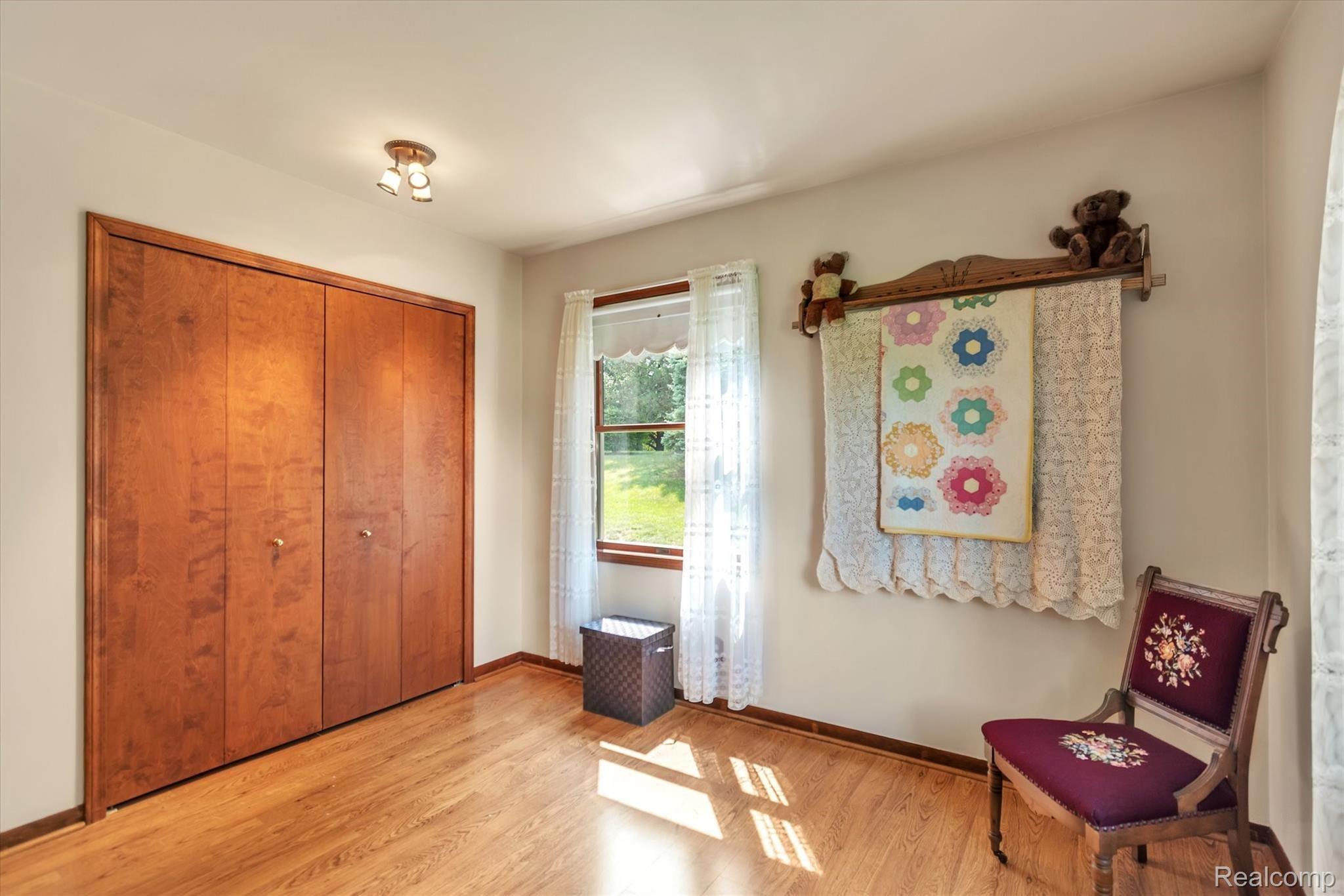 6451 Bullard Road Fenton, MI 48430 - Photo 20 of 29 Second bedroom with large closet and window for natural light