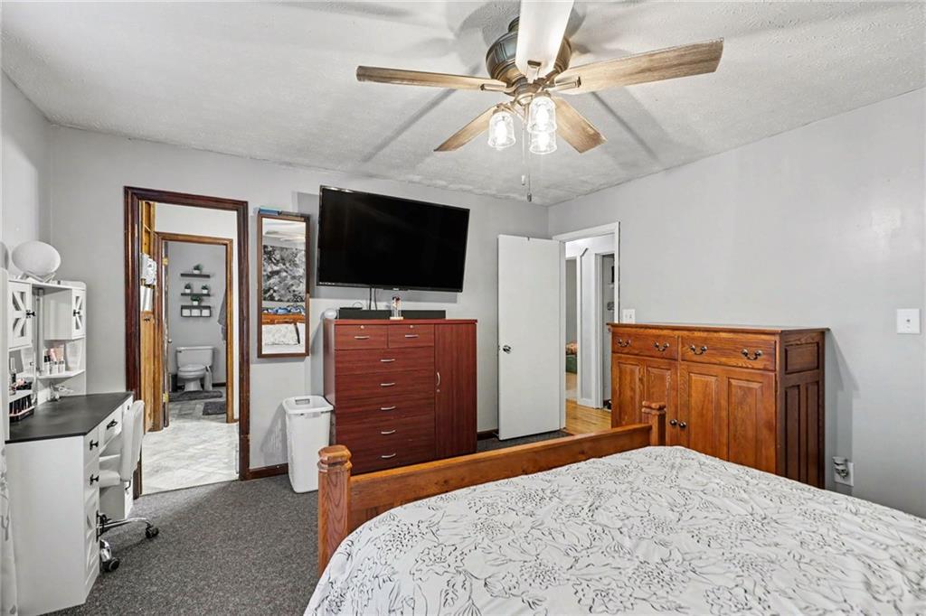 7388 Post Road Winston, GA 30187 - Photo 20 of 32 a bedroom with a bed and a flat screen tv