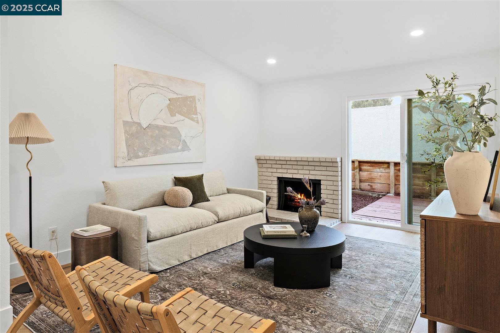 3575 Desanie Circle Bay Point, CA 94565 - Photo 11 of 37 a living room with furniture and a fireplace