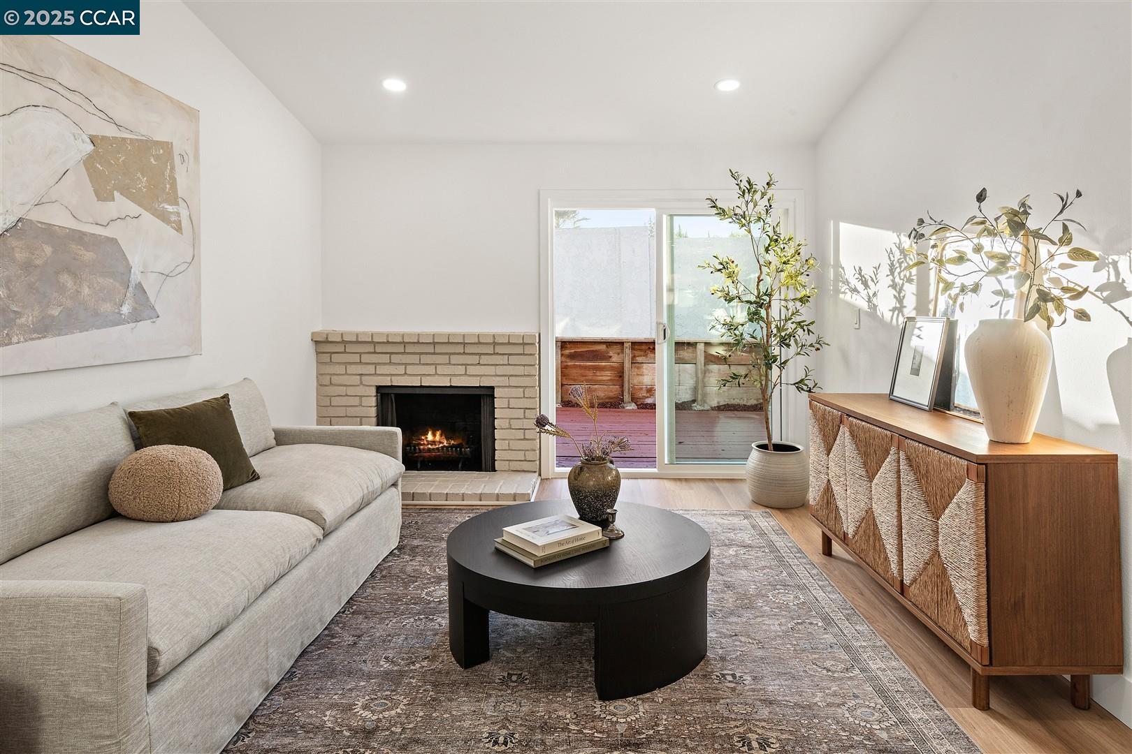3575 Desanie Circle Bay Point, CA 94565 - Photo 12 of 37 a living room with furniture and a fireplace