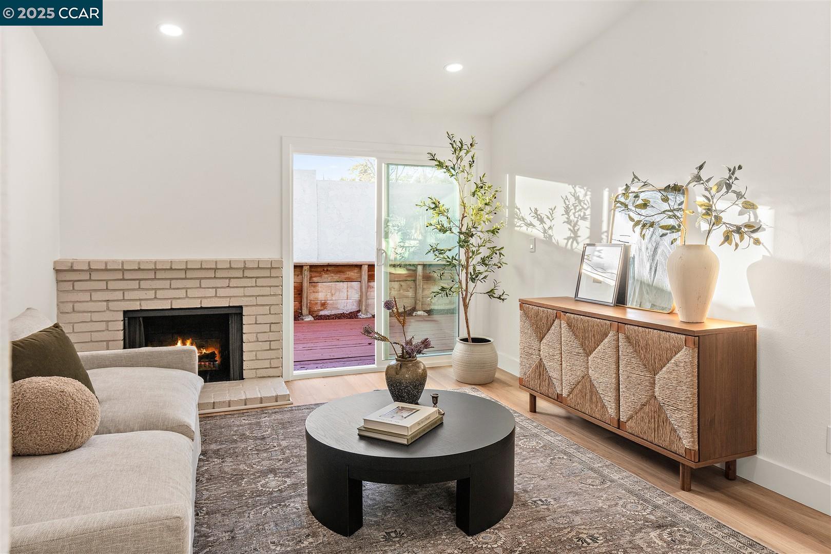 3575 Desanie Circle Bay Point, CA 94565 - Photo 14 of 37 a living room with furniture a potted plant and a fireplace