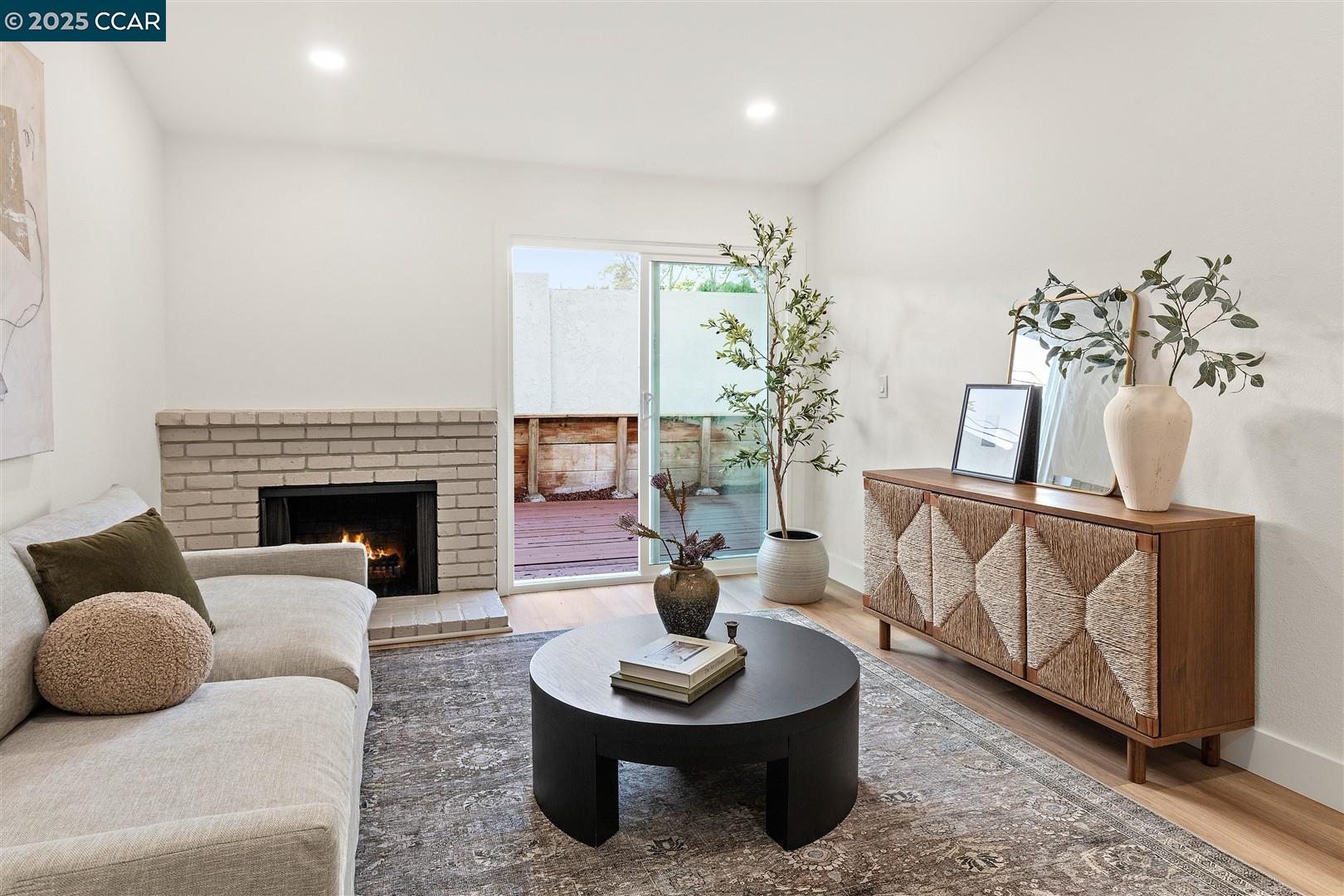 3575 Desanie Circle Bay Point, CA 94565 - Photo 16 of 37 a living room with furniture and a fireplace