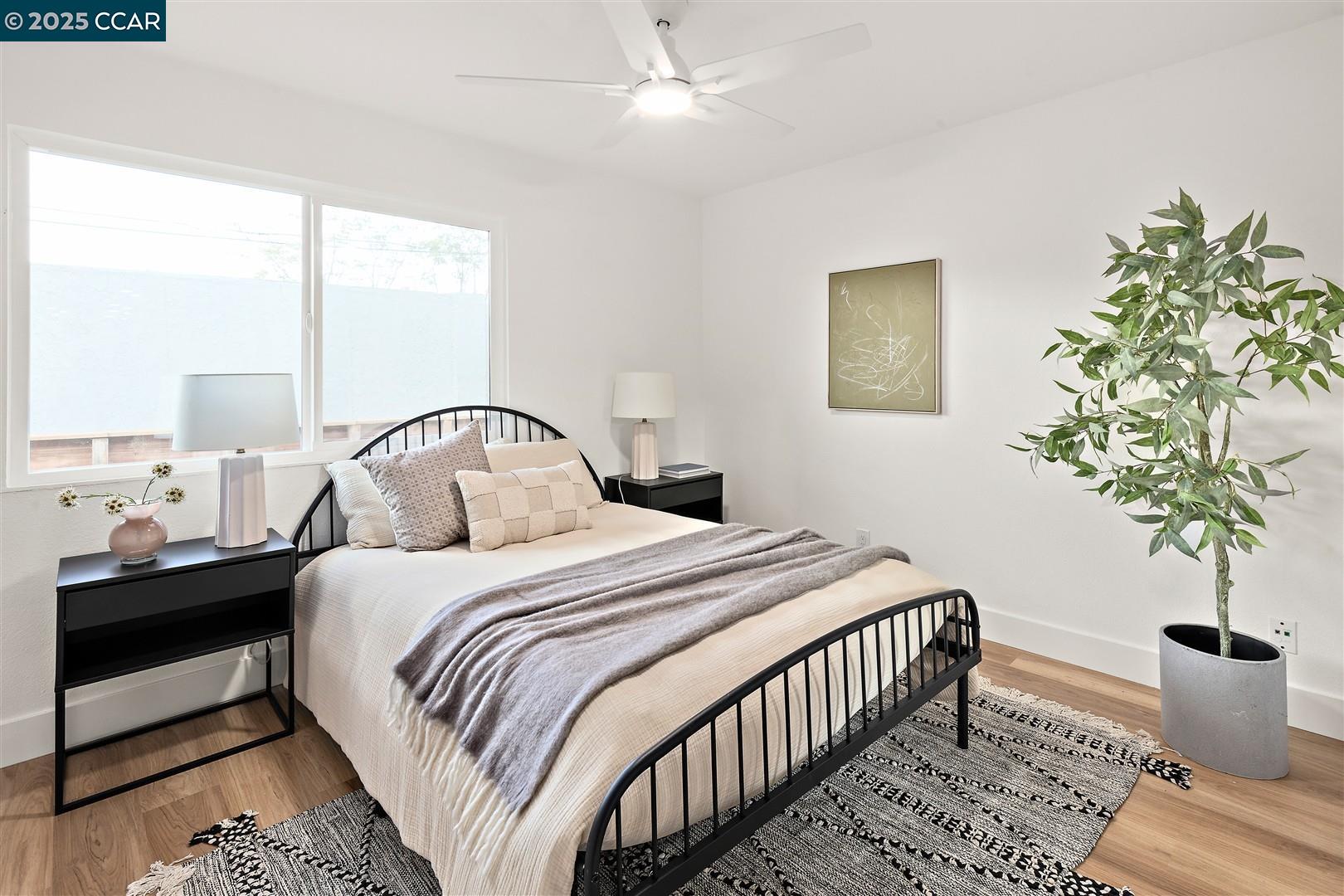 3575 Desanie Circle Bay Point, CA 94565 - Photo 18 of 37 a bedroom with bed and a potted plant