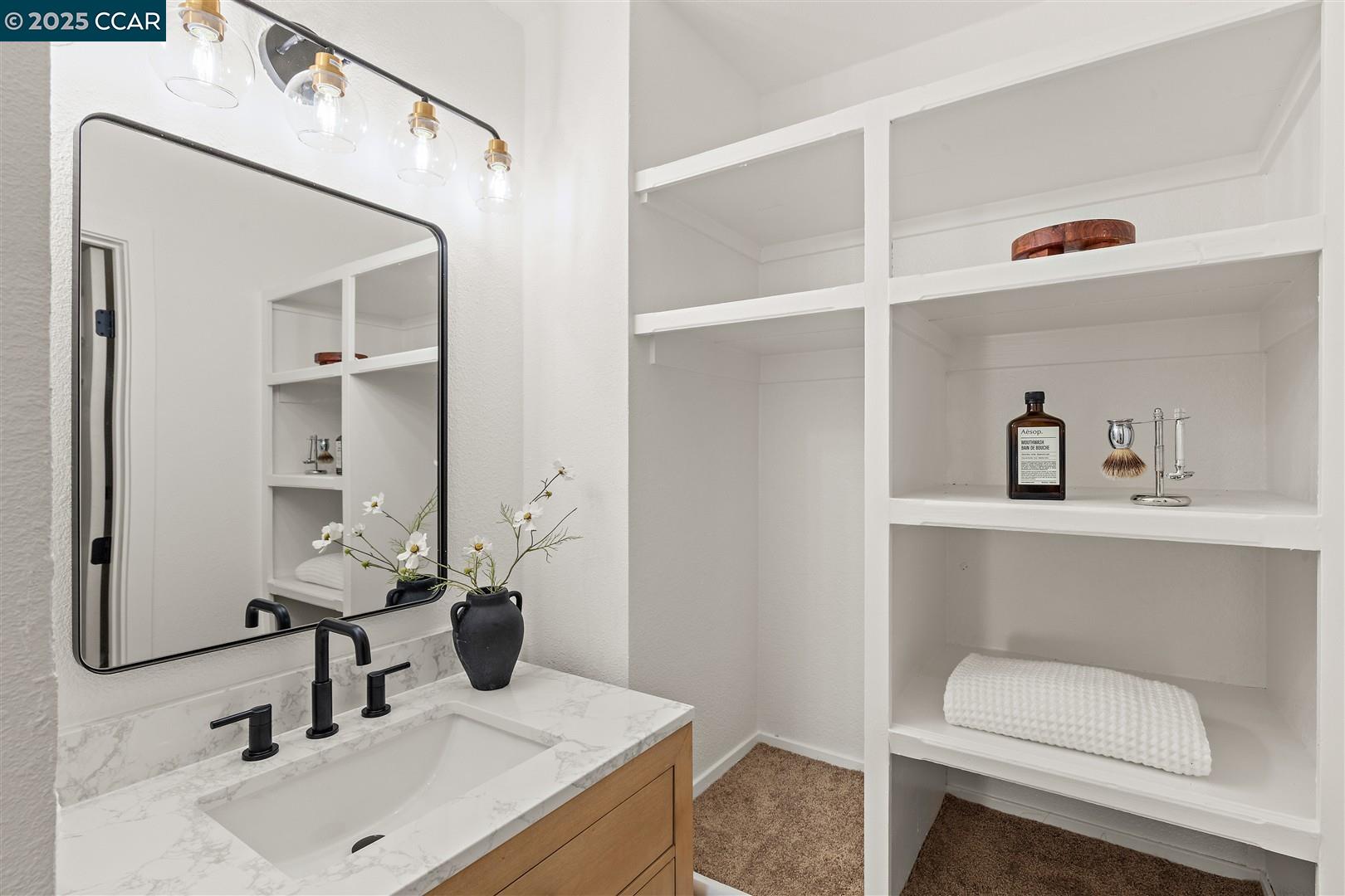 3575 Desanie Circle Bay Point, CA 94565 - Photo 22 of 37 a bathroom with a sink and a mirror