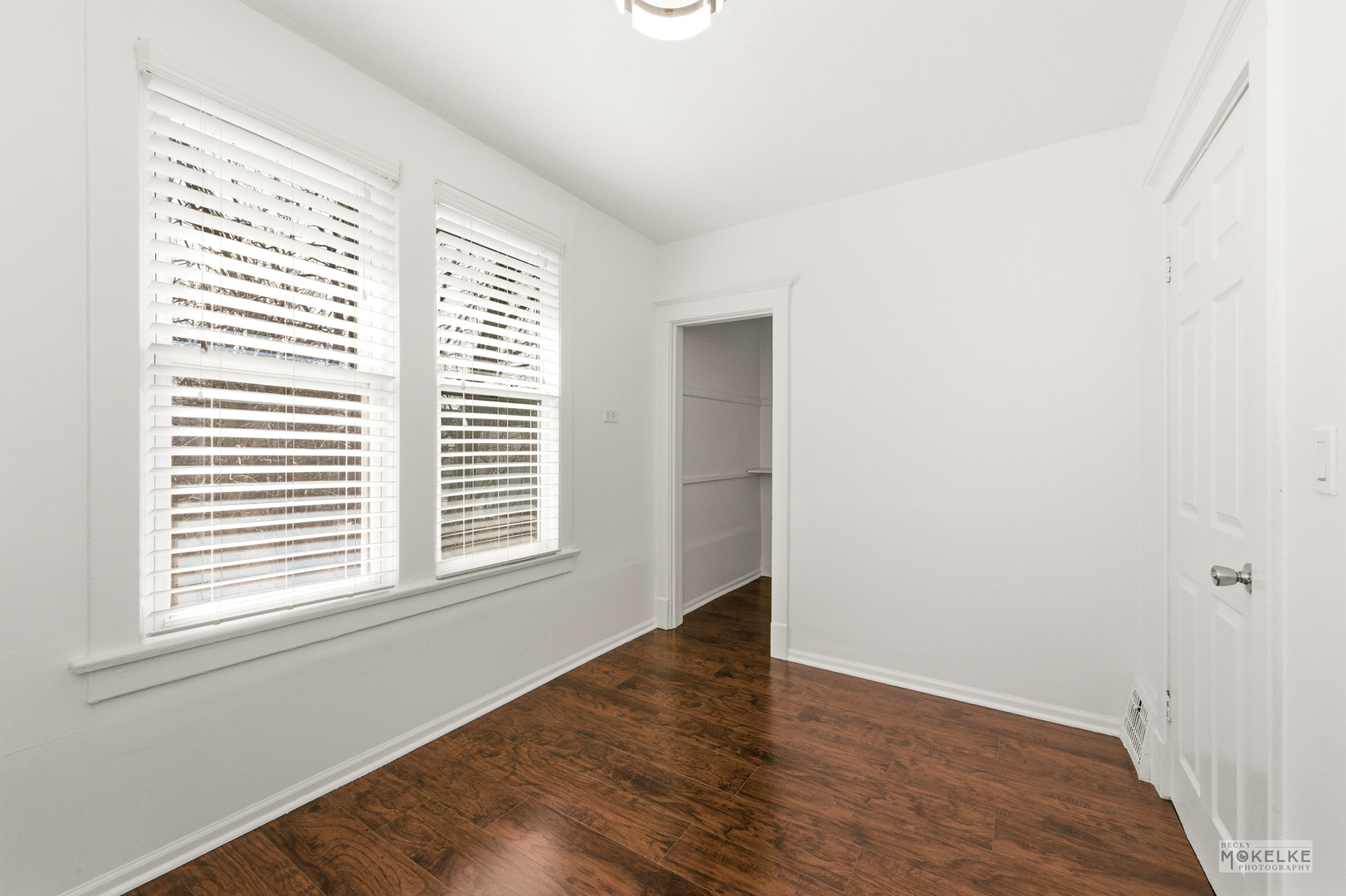 363 Franklin Boulevard Elgin, IL 60120 - Photo 12 of 32 an empty room with wooden floor and windows