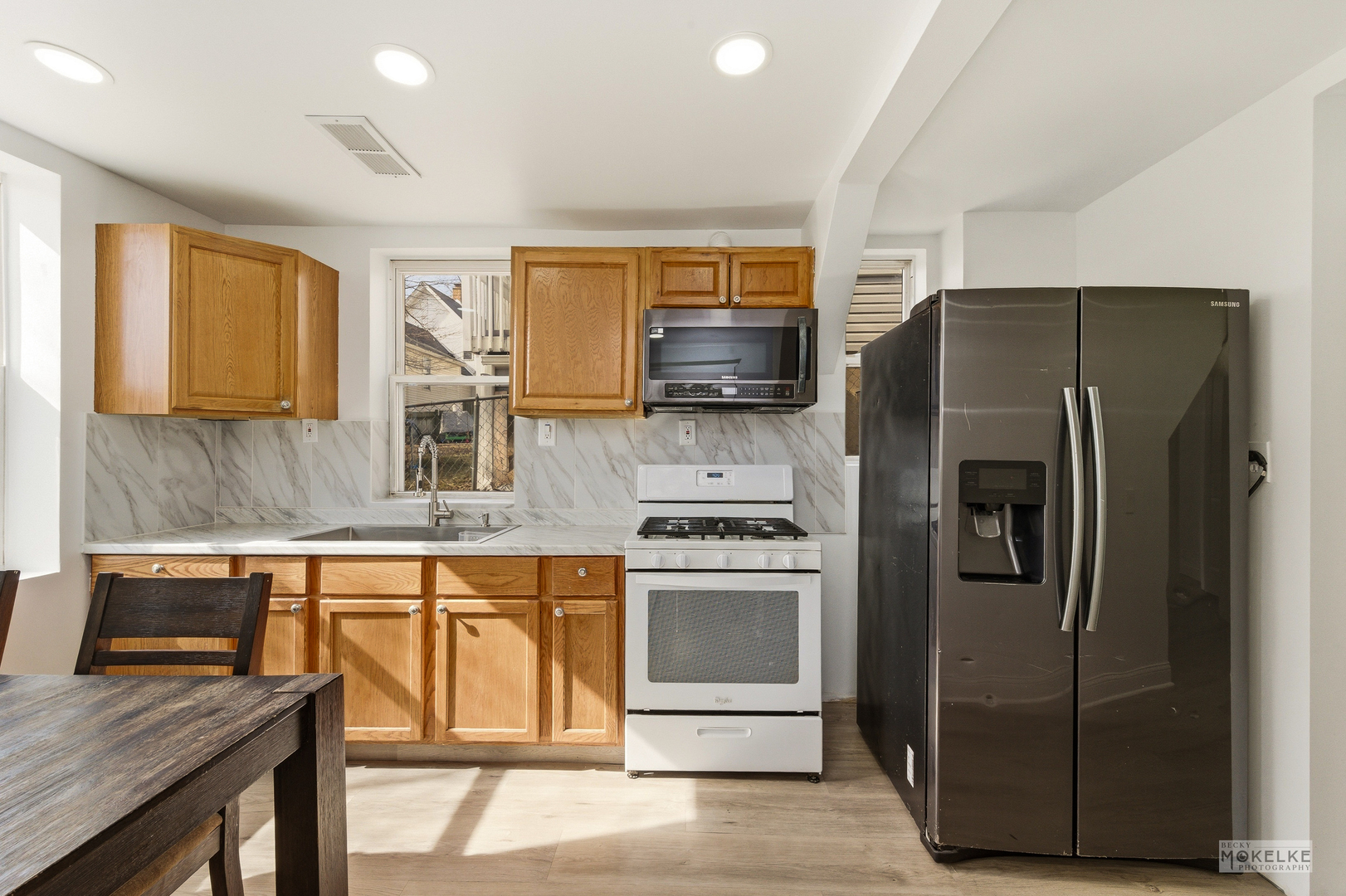 363 Franklin Boulevard Elgin, IL 60120 - Photo 15 of 32 a kitchen with stainless steel appliances granite countertop a refrigerator a stove a sink and a microwave