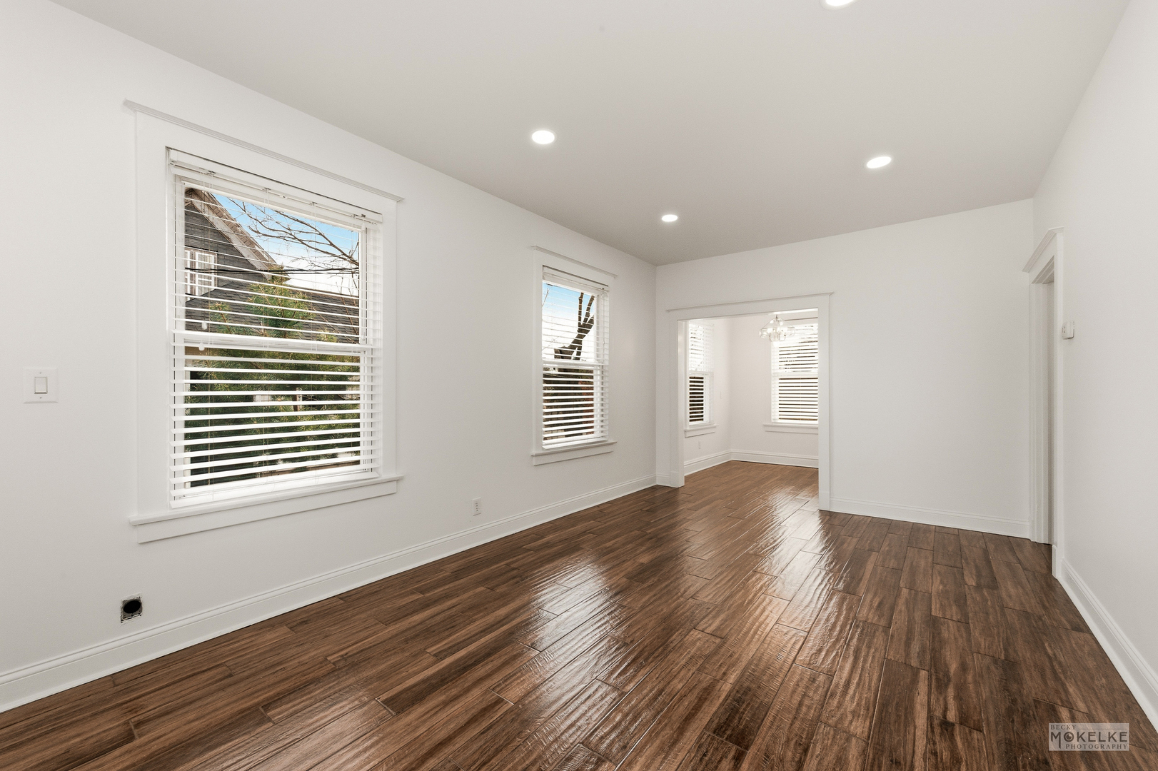 363 Franklin Boulevard Elgin, IL 60120 - Photo 4 of 32 a view of an empty room with wooden floor and a window