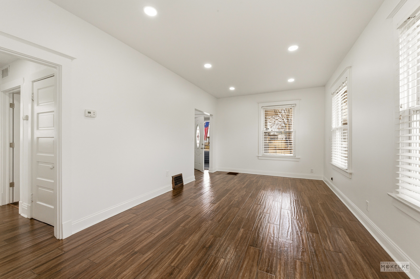 363 Franklin Boulevard Elgin, IL 60120 - Photo 5 of 32 an empty room with wooden floor and windows