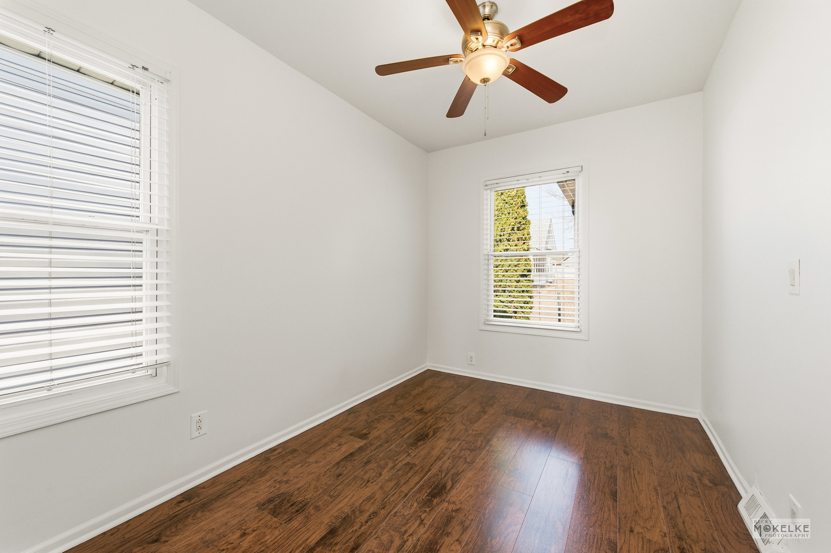363 Franklin Boulevard Elgin, IL 60120 - Photo 10 of 32 wooden floor in an empty room with a window