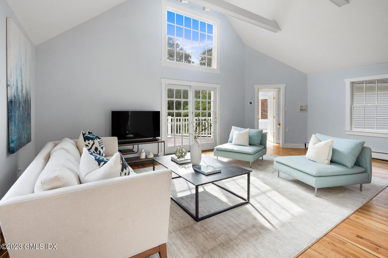 22 Drummer Lane Redding, CT 06896 - Photo 15 of 40 a living room with furniture and a flat screen tv