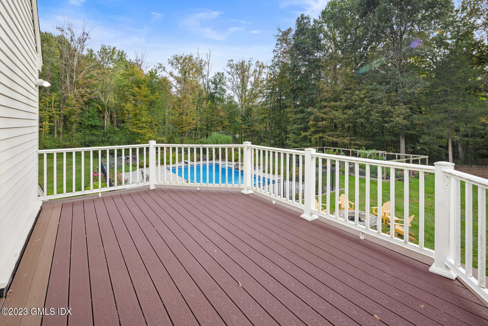22 Drummer Lane Redding, CT 06896 - Photo 16 of 40 a view of backyard with deck and wooden floor