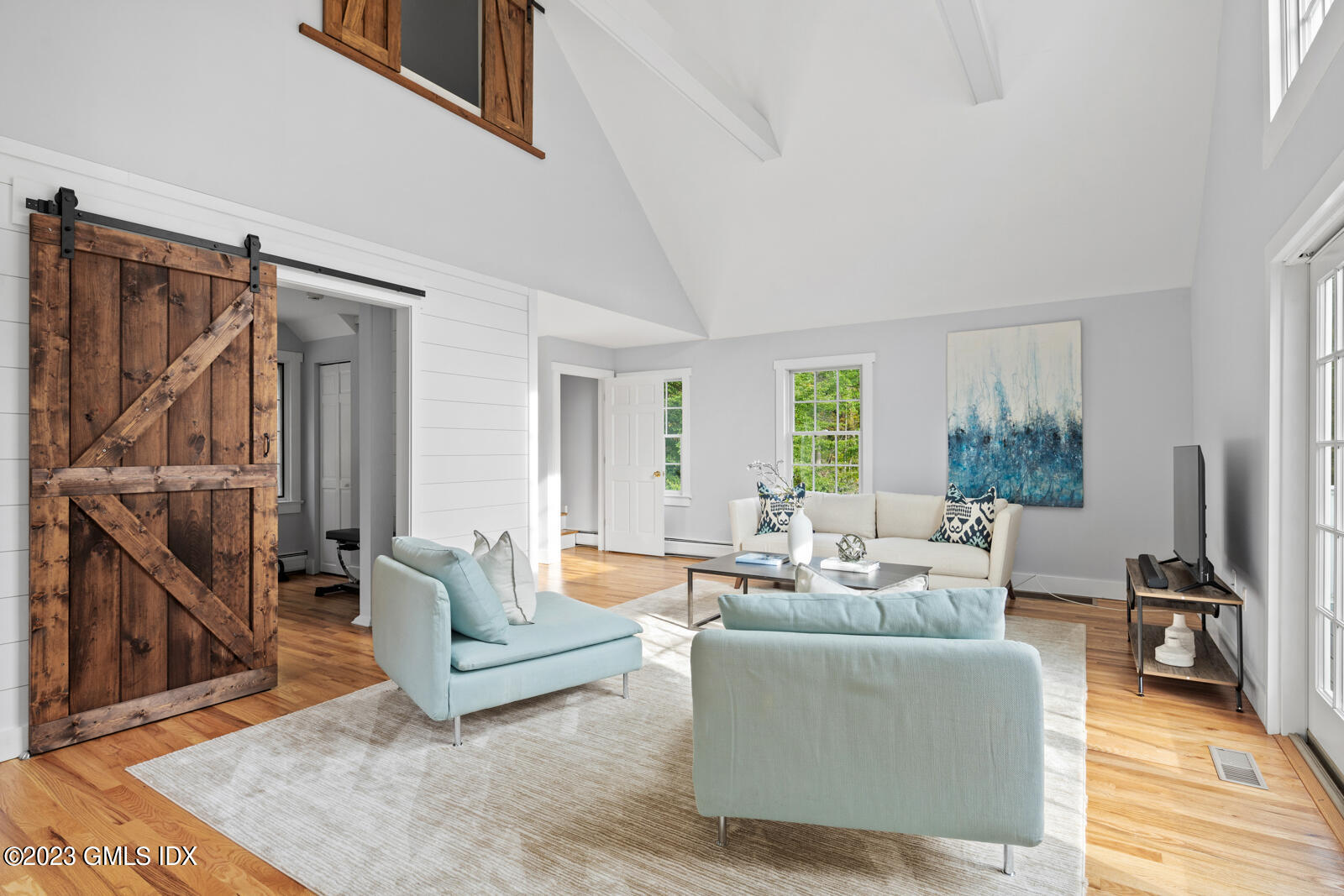 22 Drummer Lane Redding, CT 06896 - Photo 18 of 40 a living room with furniture and a wooden floor