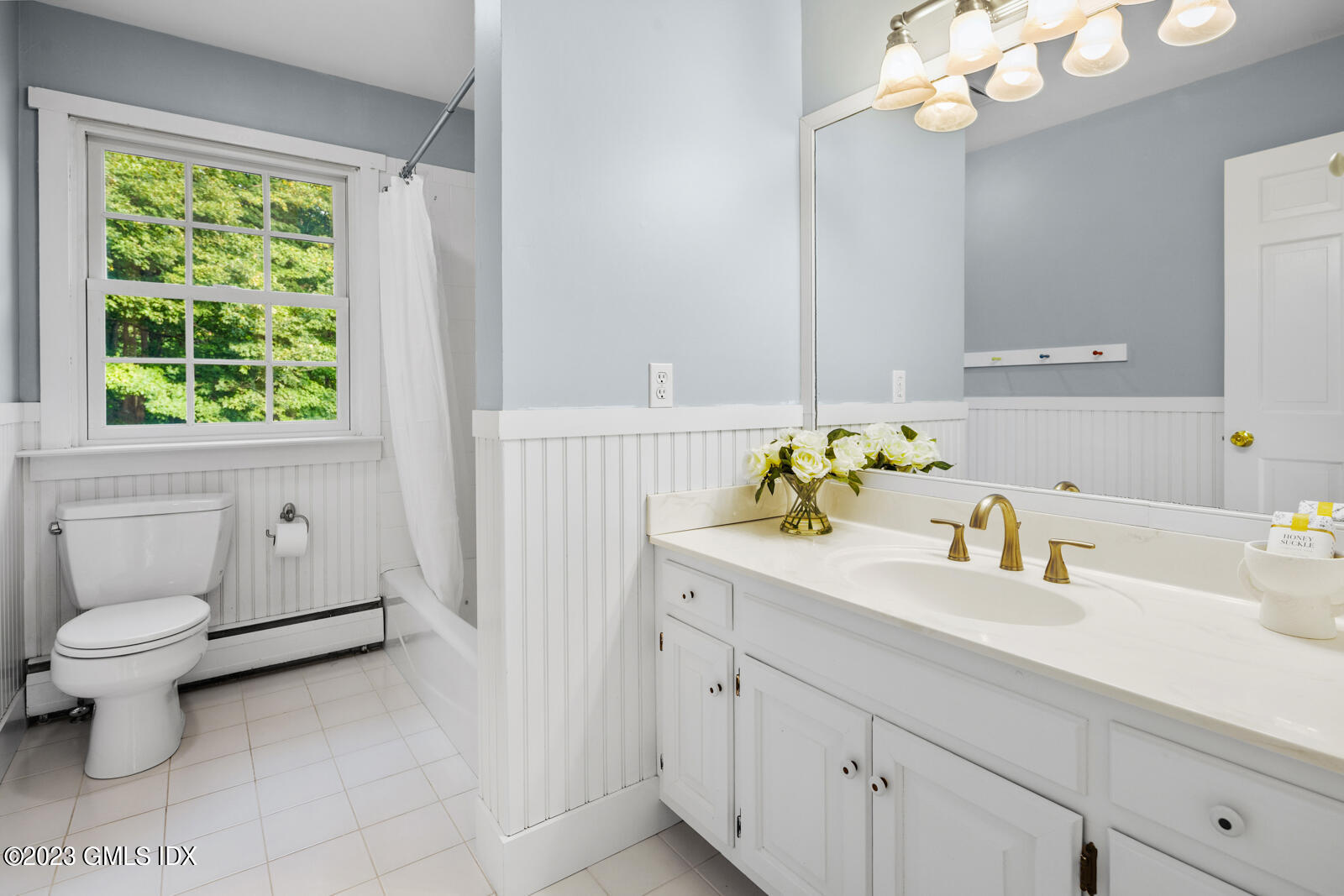 22 Drummer Lane Redding, CT 06896 - Photo 19 of 40 a bathroom with a sink a toilet and a window