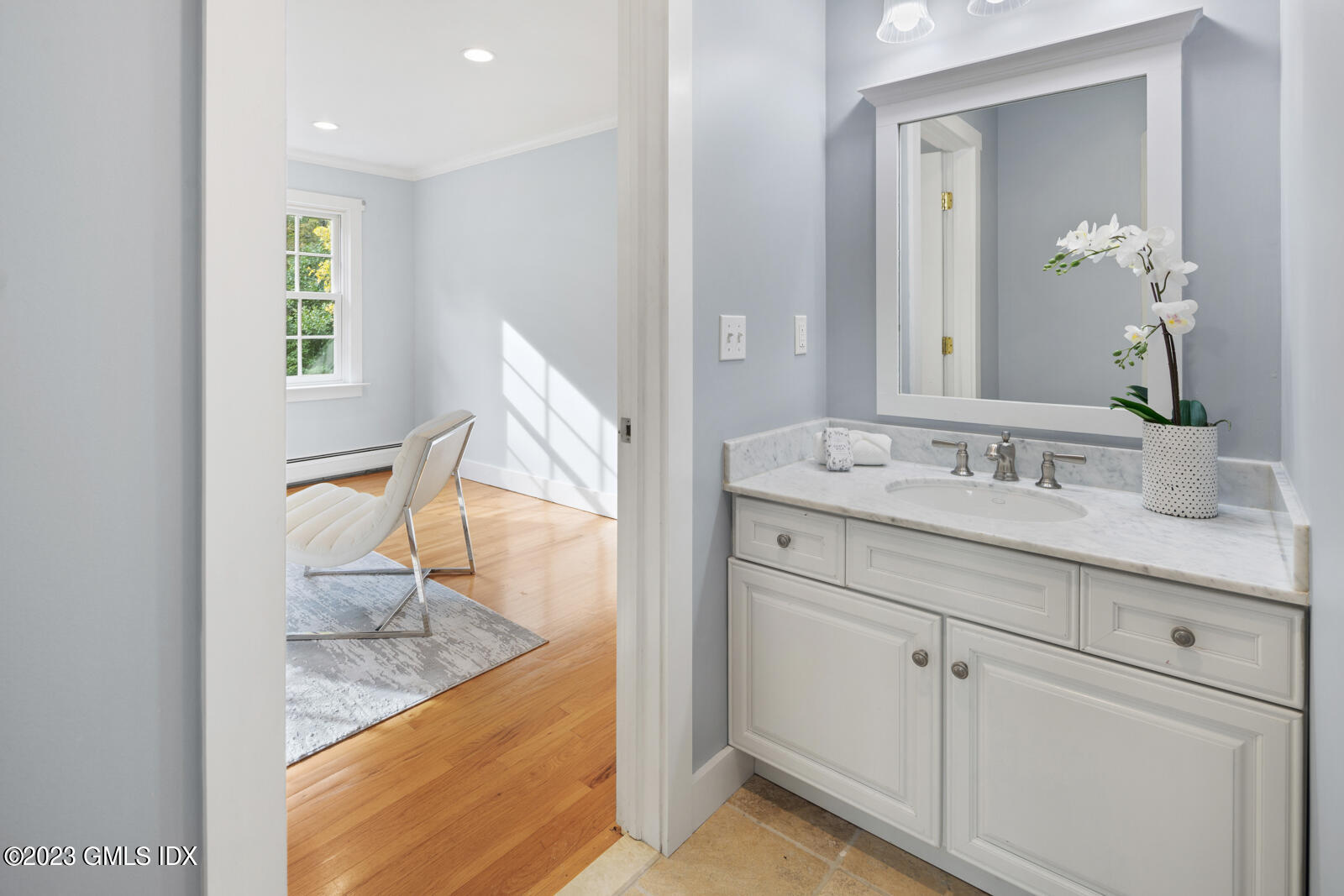22 Drummer Lane Redding, CT 06896 - Photo 23 of 40 a en suite bathroom with a granite countertop sink and a mirror