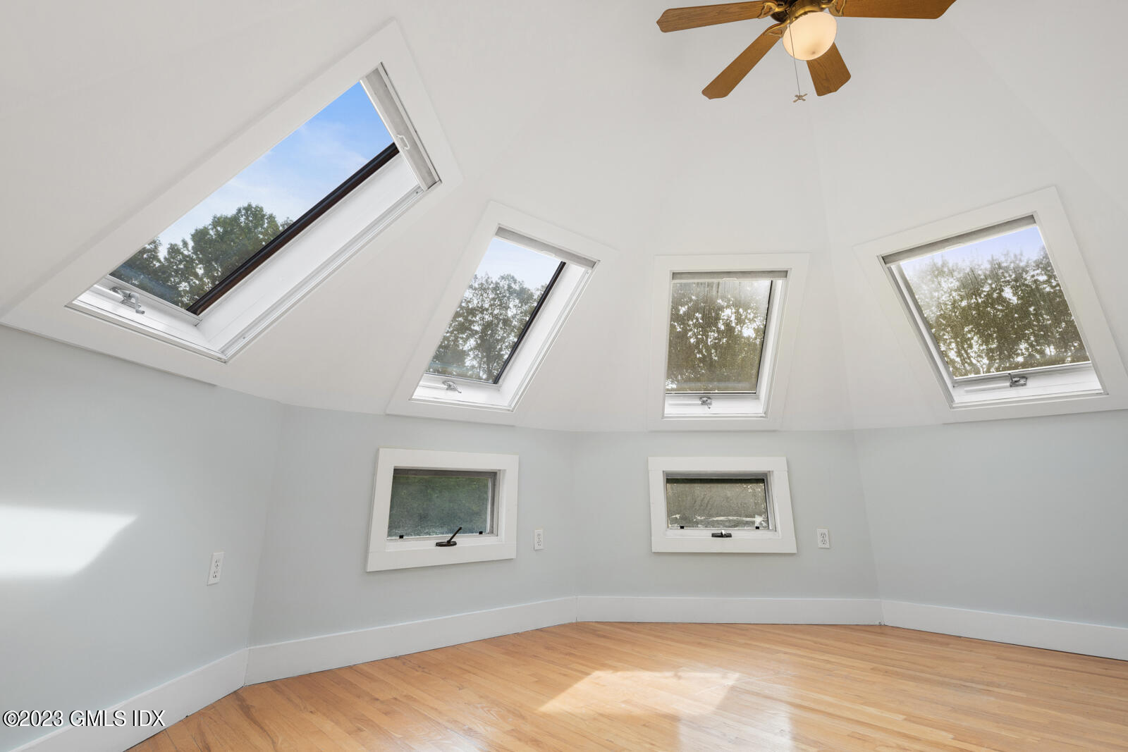 22 Drummer Lane Redding, CT 06896 - Photo 27 of 40 a view of a bedroom with wooden floor and window