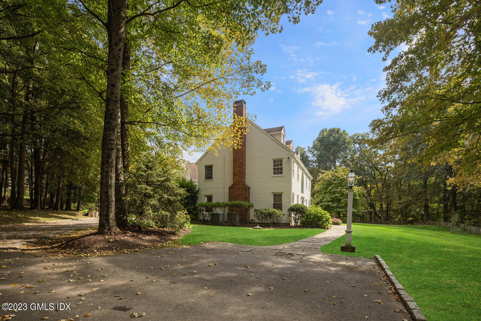 22 Drummer Lane Redding, CT 06896 - Photo 33 of 40 a front view of a house with a yard