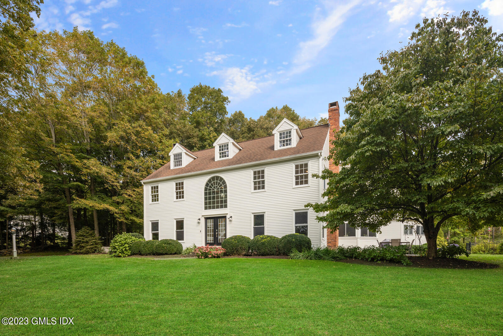 22 Drummer Lane Redding, CT 06896 - Photo 35 of 40 a view of a white house with a big yard and large trees